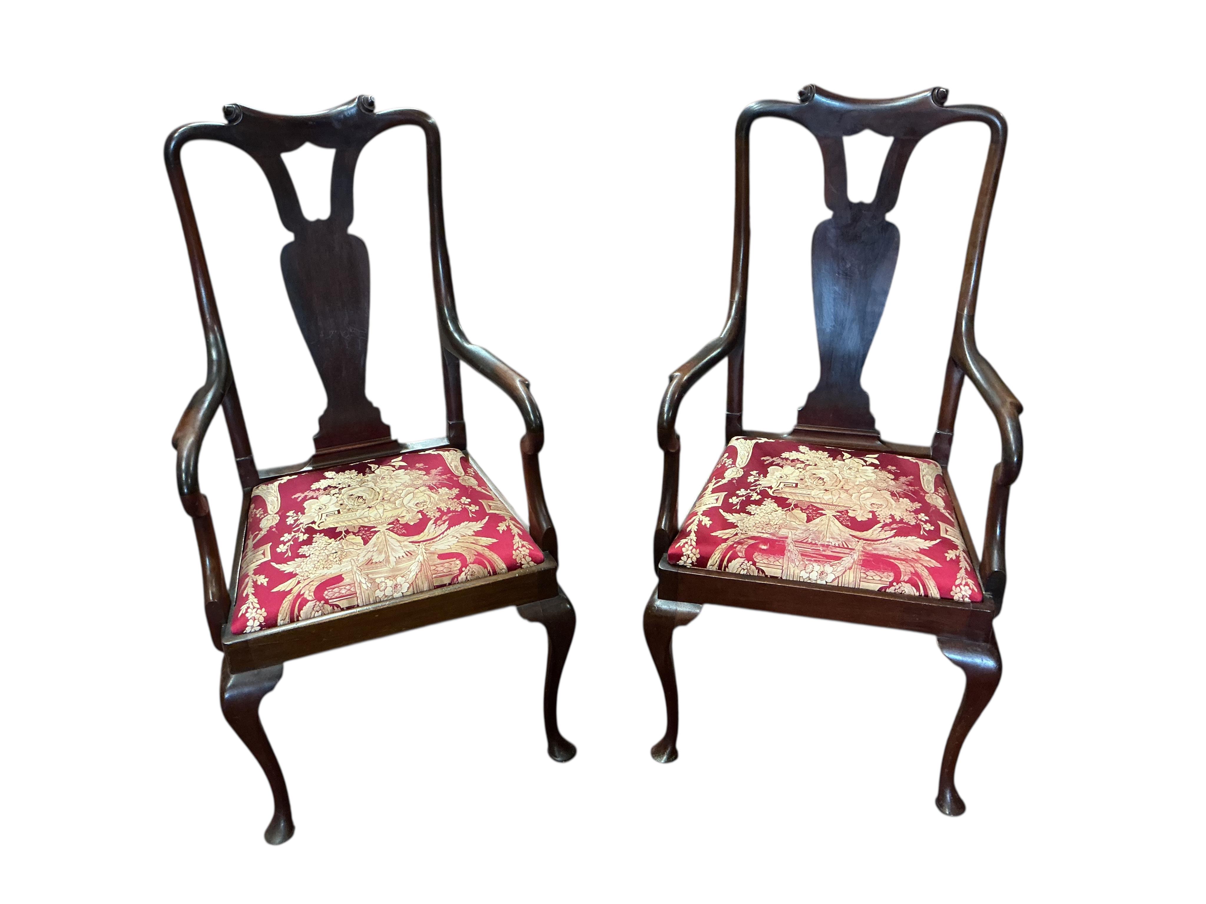A set of eight early 20th century Queen Anne style mahogany dining chairs with silk brocade drop in seats, two with arms